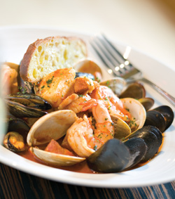 Photo: Ameritage's cioppino is made of shrimp, clams, mussels and whitefish in a spicy tomato broth. Photograph by Thom Thompson
